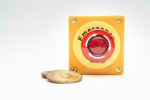 crypto currency price stop loss concept, big red pushing emergency stop button on white background. financial disaster and crisis protection when market price fall. photo