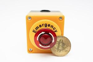 crypto currency price stop loss concept, big red pushing emergency stop button on white background. financial disaster and crisis protection when market price fall. photo