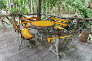 Wood table and chairs in the park photo