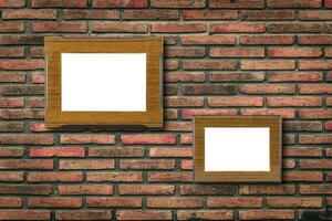 Blank photo wood frame on old brick wall