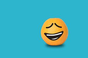 Orange face funny on blue background. Clipping path photo