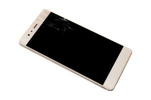 Smartphone with broken screen on wooden photo