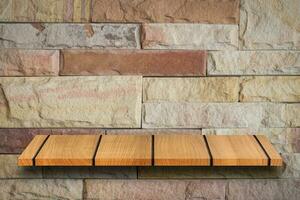 Empty top wooden shelves and stone wall background. For product display photo