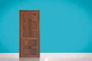Close up of closed modern bright wooden door on blue background. Blank space photo