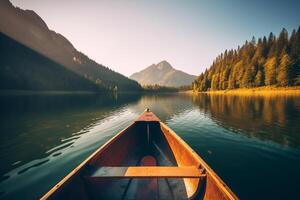 Canoe floating on a serene mountain lake surrounded by tall pine trees on a peaceful morning. photo