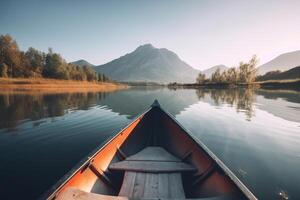 Canoe floating on a serene mountain lake surrounded by tall pine trees on a peaceful morning. photo