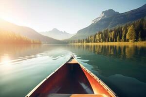 Canoe floating on a serene mountain lake surrounded by tall pine trees on a peaceful morning. photo