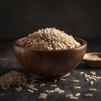 Uncooked brown rice in a wooden bowl ,. photo