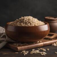 Uncooked brown rice in a wooden bowl ,. photo