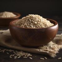 Uncooked brown rice in a wooden bowl ,. photo