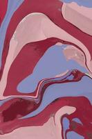 Spread-out acrylic paint. Abstract background, made in the technique of fluid art. Changing colors of the year concept. Very Peri and Viva Magenta. photo