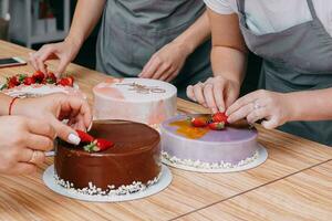 A piece of chocolate cake in the cut. Preparation of mousse cake at a culinary master class. Cooking at home, homemade food photo