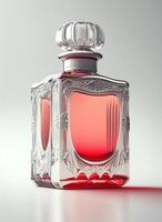 A high class bottle of glass perfume with light red liquid. Aromatic perfume bottles on white background. Beauty product, cosmetic, perfume day, fragrance day or perfume launch event by photo