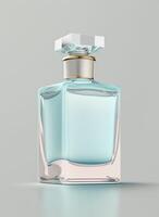 A high class bottle of glass perfume with light blue liquid. Aromatic perfume bottles on white background. Beauty product, cosmetic, perfume day, fragrance day or perfume launch event by photo
