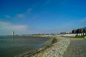 Buesum is a village at the German northern sea with harbor and lighthouse photo