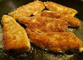 breaded wiener schnitzel with side dishes photo