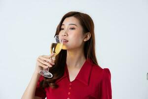 Portrait of a beautiful, charming lady wearing a red dress on a white background photo