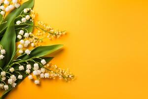 Fragrant Lily-of-the-Valley Blooms on Vibrant Yellow-Orange Background photo