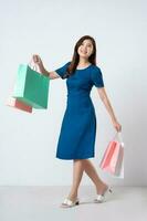 Asian girl portrait in blue dress on white background photo