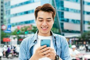 Asian man walking on the street photo