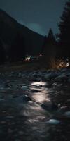 Nighttime Mountain Stream with Reflective Moon and Starlight on Glistening Stones photo