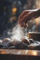 Dropping Water on Hot Stones in Sauna Steamy Relaxation photo