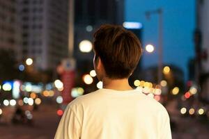 Asian man portrait in the street at night photo