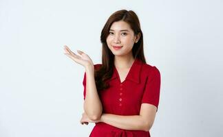 Portrait of a beautiful, charming lady wearing a red dress on a white background photo