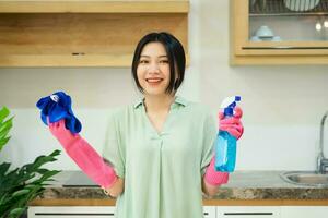 portrait of asian girl cleaning the house photo