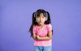 beautiful asian girl portrait posing on purple background photo