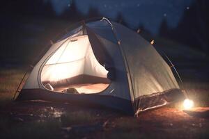 Camping in the Dark Illuminated Tent in the Forest photo