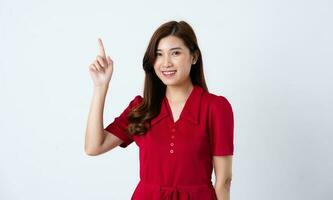 Portrait of a beautiful, charming lady wearing a red dress on a white background photo