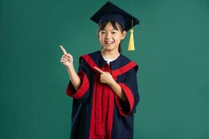 beautiful asian girl posing on blue background photo