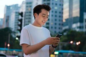 Asian man portrait in the street at night photo