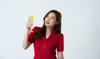 Portrait of a beautiful, charming lady wearing a red dress on a white background photo