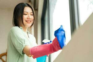 portrait of asian girl cleaning the house photo