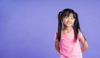 beautiful asian girl portrait posing on purple background photo