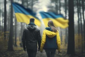 Freedom in the Woods Ukrainian Couple with Flag Walking Hand in Hand photo