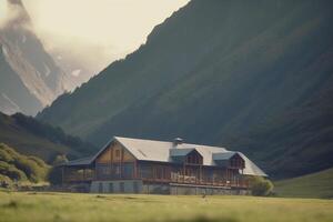 Panoramic view of a hostel in the mountains surrounded by lush green landscape photo