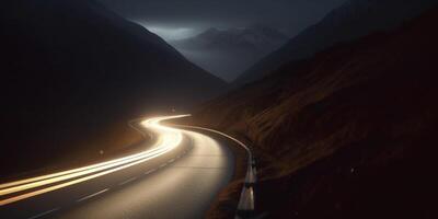 Night Drive on a Curvy Mountain Road with Long Exposure Light Trails photo