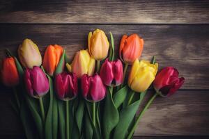 Vibrant Tulips Against Dark Wooden Background photo