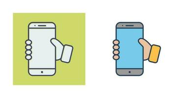 Holding Smartphone Vector Icon