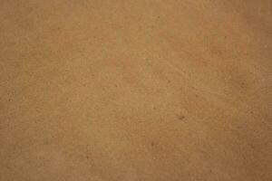 Brown paper texture close detailed background, shiny brown paper surface photo