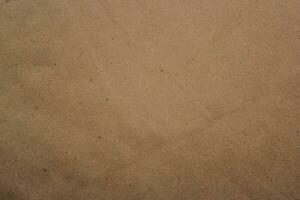 Brown paper texture close detailed background, shiny brown paper surface photo