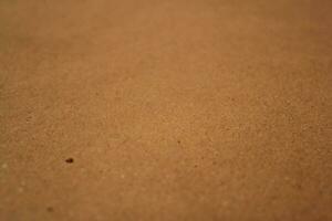 Brown paper texture close detailed background, shiny brown paper surface photo