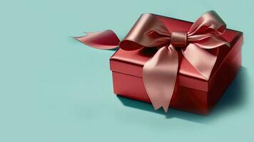 3D Render Of Matte Red Gift Box With Silk Bow Ribbon On Turquoise Background And Copy Space. photo