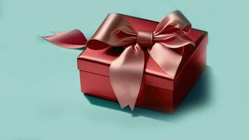 3D Render Of Matte Red Gift Box With Silk Bow Ribbon On Turquoise Background And Copy Space. photo