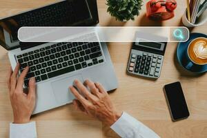 Searching browsing internet data information networking concept, Top view businessman using tablet on office desk. photo