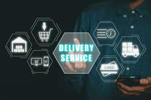 Delivery service concept, Person using smart phone and hand touching delivery service icon on virtual screen. photo