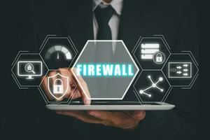 Firewall computing security concept, Person using digital tablet with Firewall icon on virtual screen, Business, Technology, Internet and network. photo